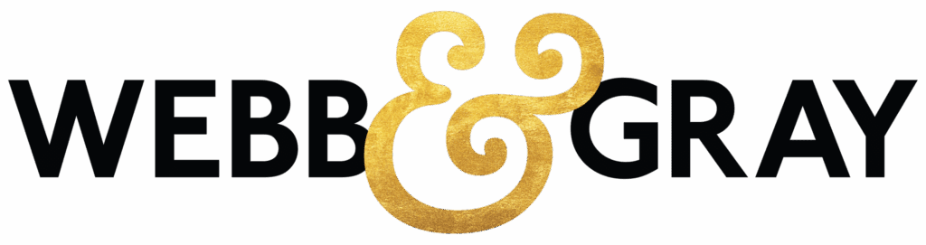 Webb & Gray logo. The words Webb and Gray are in a bold black sans serif font, seperated by a gold textured ampersand.
