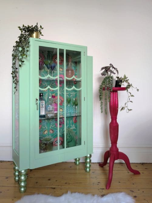 Pistachio Green Glass Display cabinet with red vintage plant stand