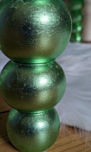 Bobbin cabinet feet gilded by hand with green dyed silver leaf