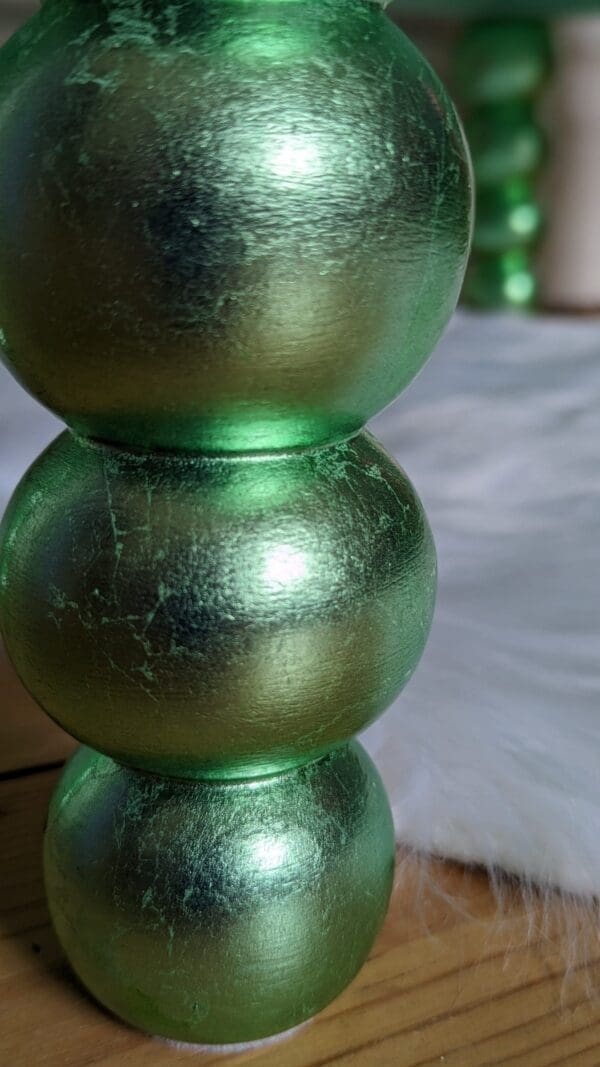 Bobbin cabinet feet gilded by hand with green dyed silver leaf