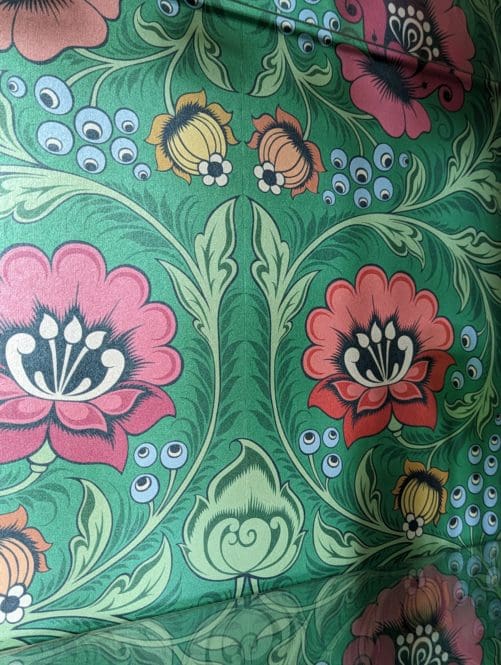Green, red and pink folk floral wallpaper to back interior surface of upcycled cabinet
