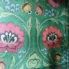 Green, red and pink folk floral wallpaper to back interior surface of upcycled cabinet