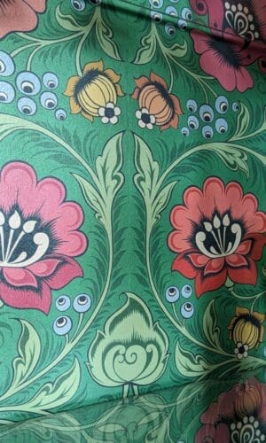 Green, red and pink folk floral wallpaper to back interior surface of upcycled cabinet