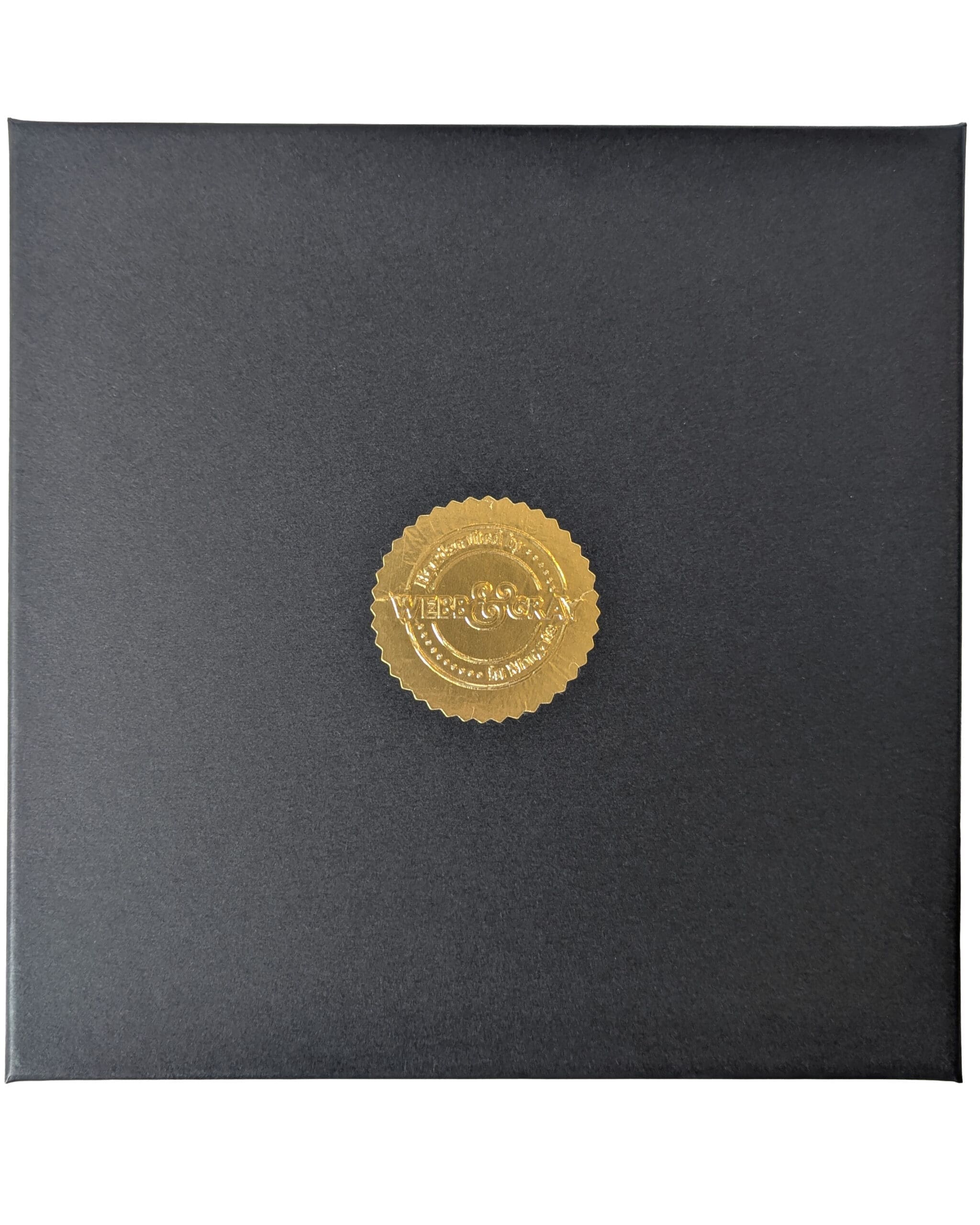 top view of black gift box with gold seal sticker - Webb & Gray