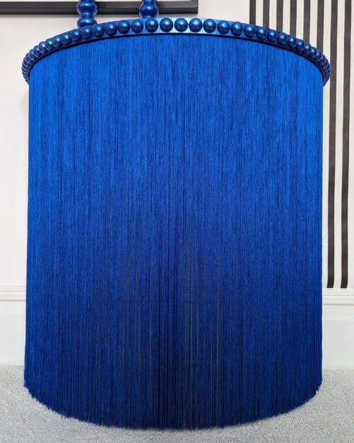 Blue round table with long silky fringing