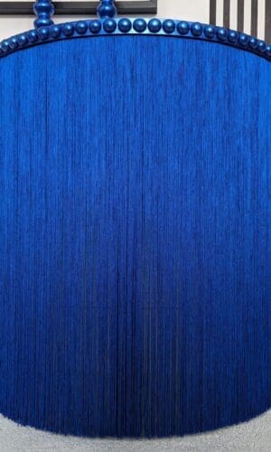 Blue round table with long silky fringing