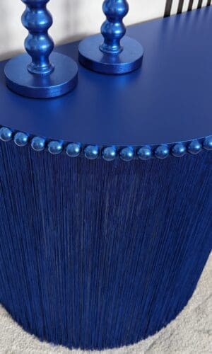 Blue semi circle console table with full length fringing