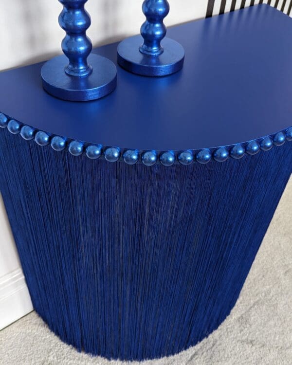 Blue semi circle console table with full length fringing