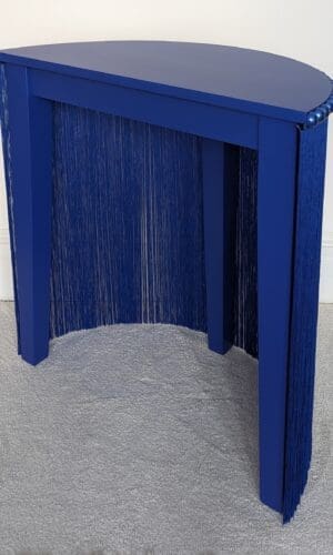 Blue console table with fringing