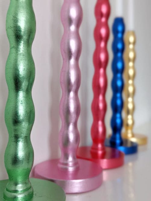 Colourful, luxury, sustainable candlesticks gilded in green, pink, red, blue and golden silver leaf