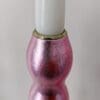 Top of artisan candlestick gilded in genuine candy pink dyed silver leaf handcarfted from reclaimed table legs