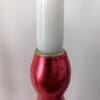 Top of artisan candlestick gilded in genuine red dyed silver leaf handcarfted from reclaimed table legs