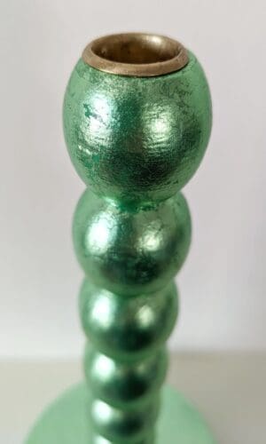 Top view of metallic green handcrafted candlestick