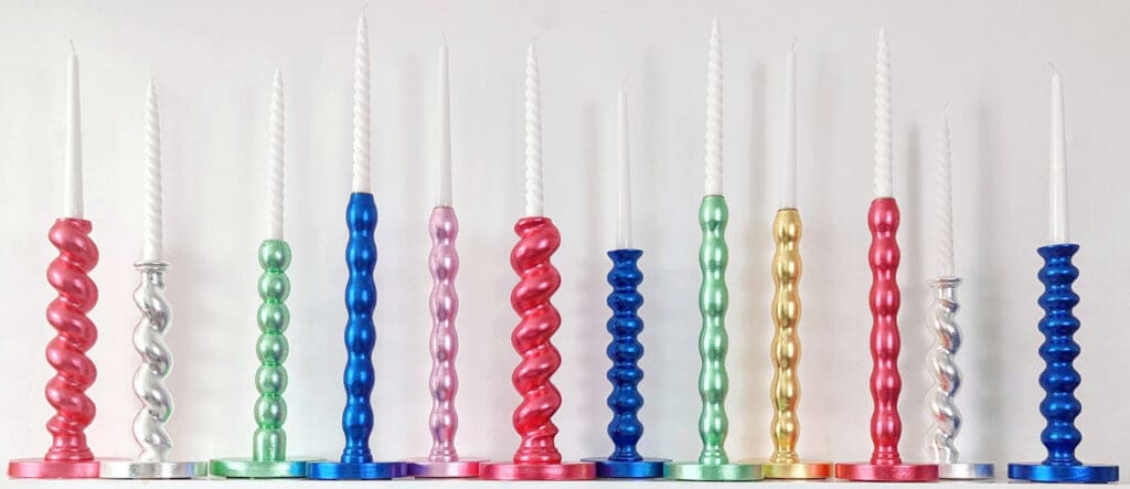 Multi-coloured contemporary gilded candlesticks made of upcycled table legs
