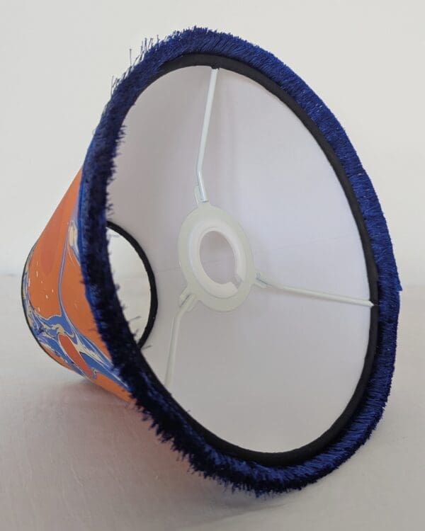 orange and blue marbled lampshade underside view