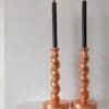 peach candlesticks with black candles