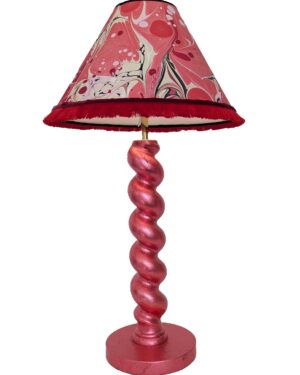 Handmade red cordless lamp made from reclaimed wood shown with red and gold marbled lampshade