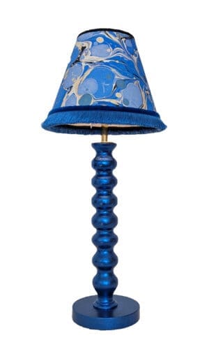 Blue cordless lamp finished in blue dyed silver leaf shown with blue marbled paper lampshade