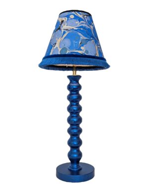 Blue cordless lamp finished in blue dyed silver leaf shown with blue marbled paper lampshade