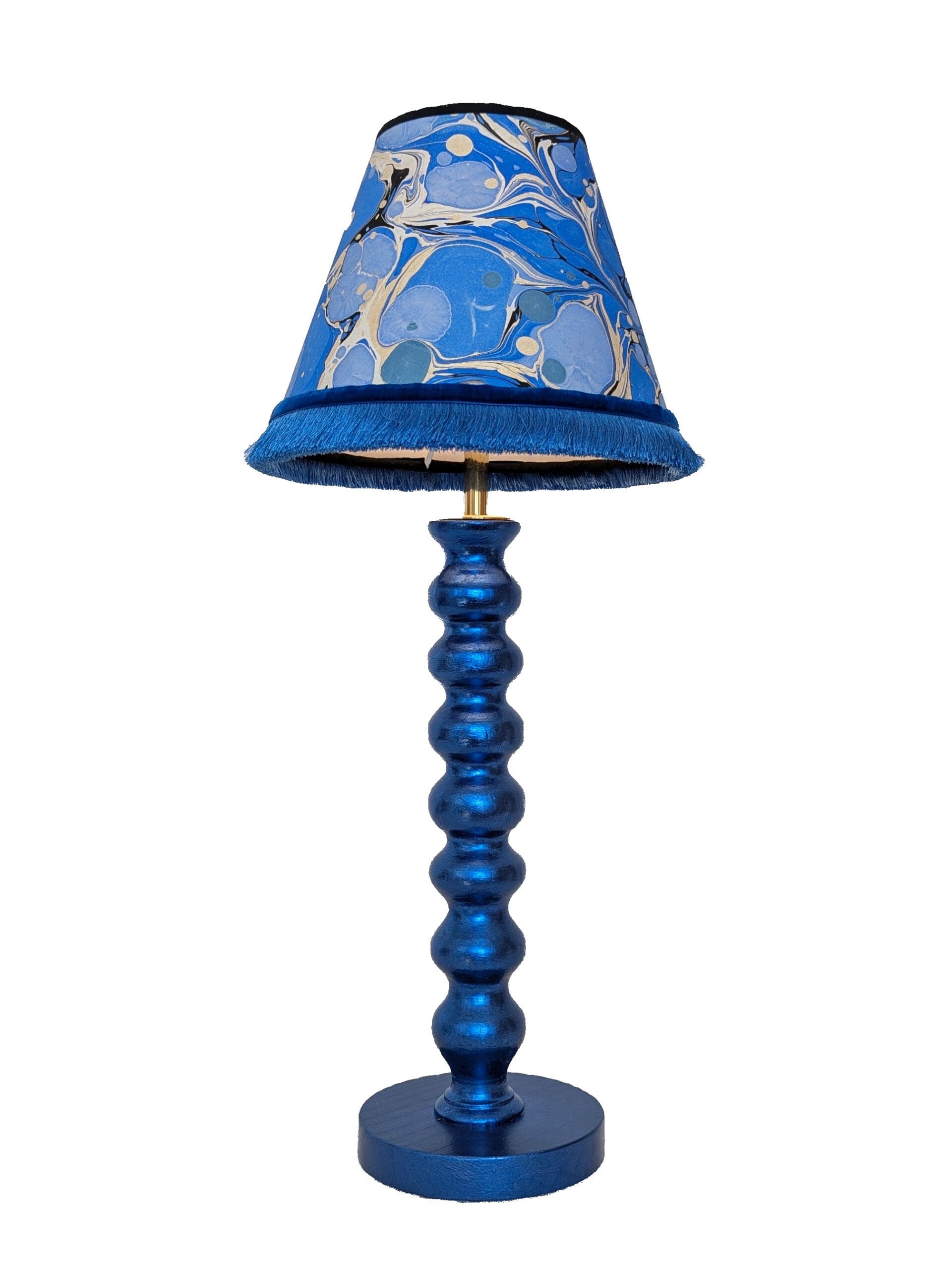 Blue cordless lamp finished in blue dyed silver leaf shown with blue marbled paper lampshade