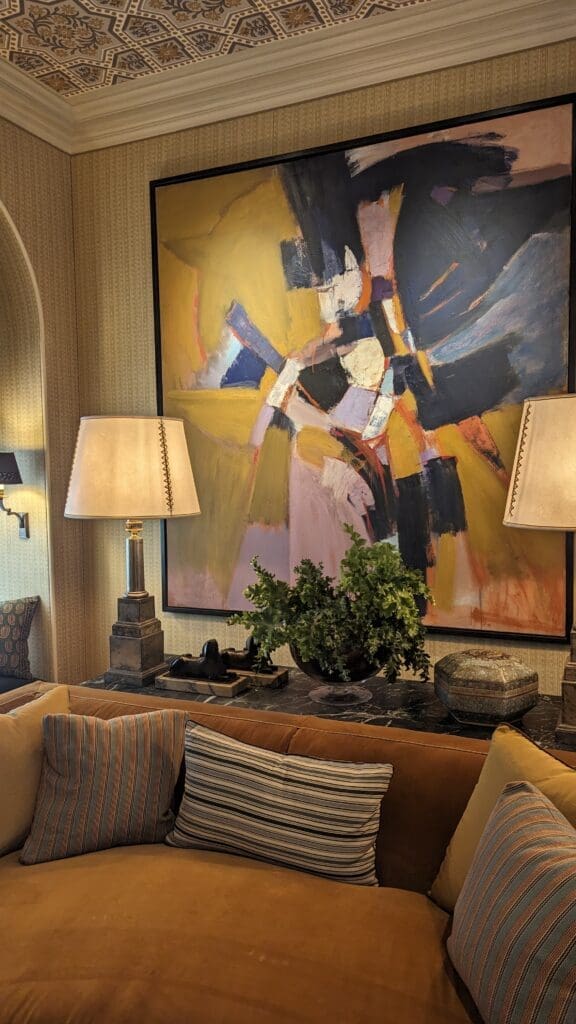 Large abstract painting behind a sofa