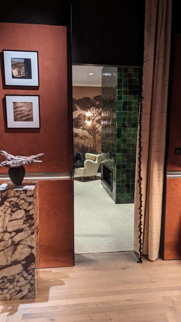 PXL_20240604_135258306.RAW-01.COVER Doorway with teracotta walls and marble plinth