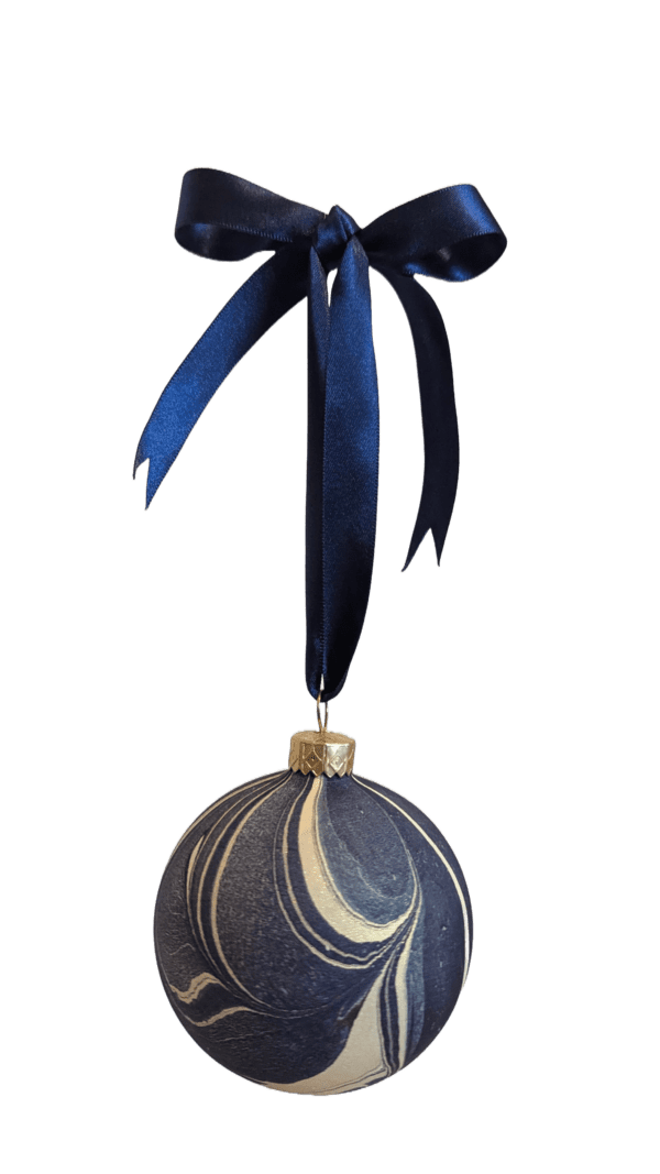 Navy blu eand gold marbled christmas bauble decoration on blue ribbon