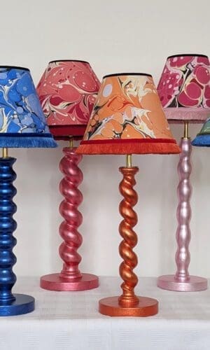 Collection of colourful table lamps made from reclaimed table legs gilded in coloured silver leaf with matching handmade marbled shades