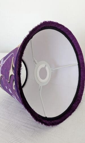inside view of purple marbled lampshade showing white cardboard lining