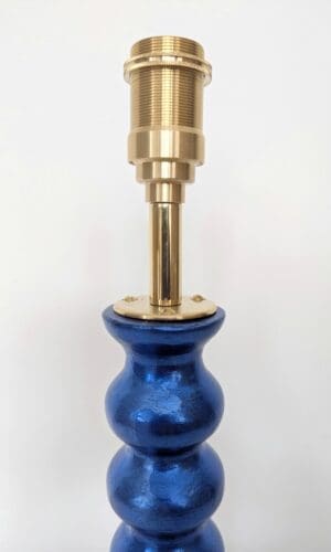 detail of brass bulb holder on blue cordless lamp