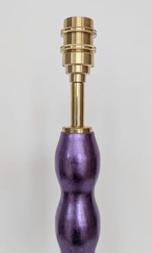 close up of purple gilded cordless lamp showing brass bulb holder for rechargeable bulb