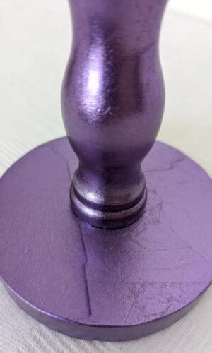 detail of purple cordless lamp showing base gilded in purple silver leaf
