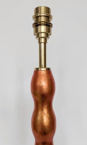 close up of bulb holder on orange wavy cordless lamp