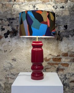 Large red gloss chunky table lamp with geometric patterned fabric lampshade