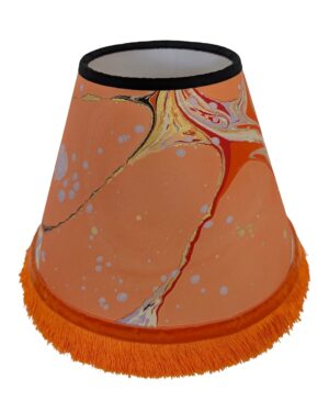 Peach marbled lampshade with orange fringing and velvet ribbon trim