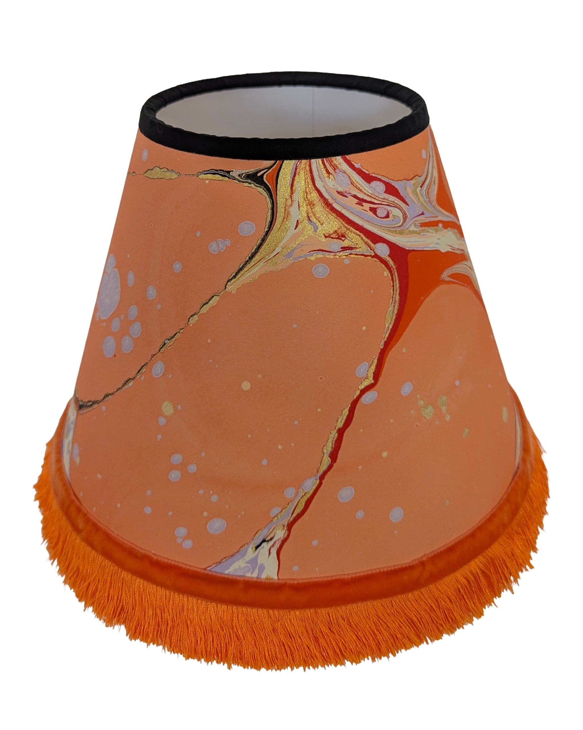 Peach marbled lampshade with orange fringing and velvet ribbon trim