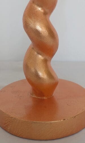 Base of peach cordless lamp showing texture of real peach dyed silver leaf finish