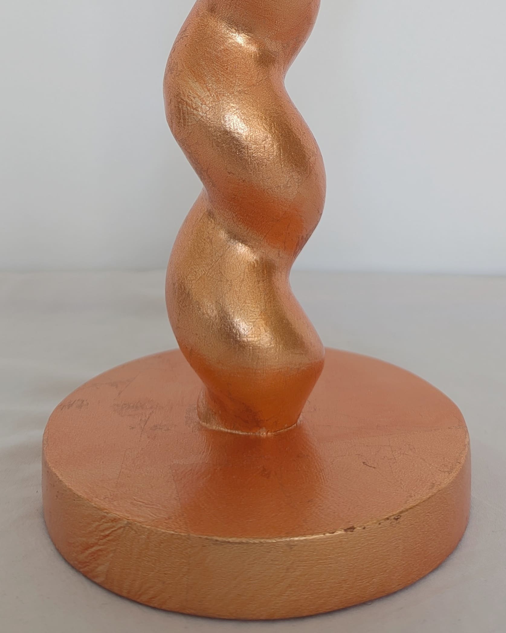 Base of peach cordless lamp showing texture of real peach dyed silver leaf finish