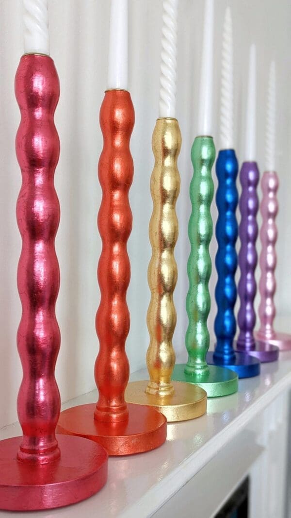 Rainbow of gilded wavy candlesticks