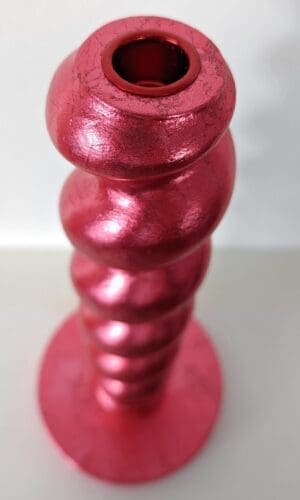 Top view of metallic red handcrafted candlestick