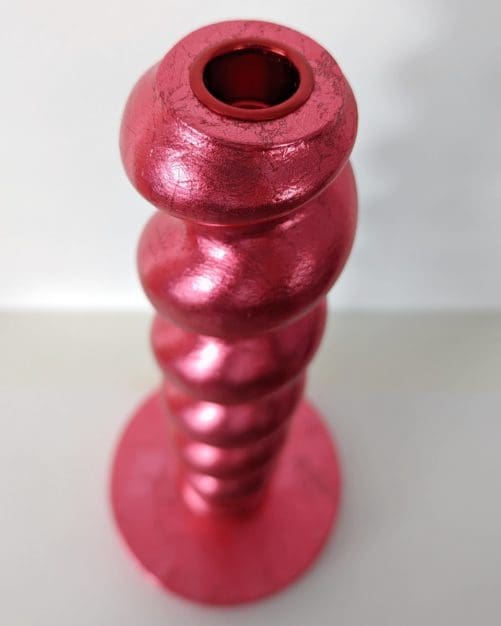 Top view of metallic red handcrafted candlestick