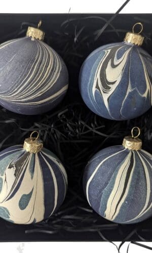 set of 4 navy blue and gold marbled Christmas baubles in a black box