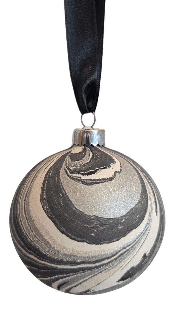 Grey and silver luxury marbled Christmas bauble decoration hanging from dark grey ribbon