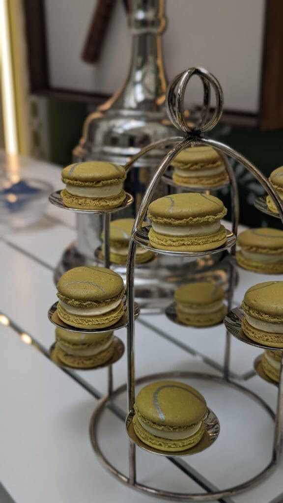 Yellow macarons on a silver stand