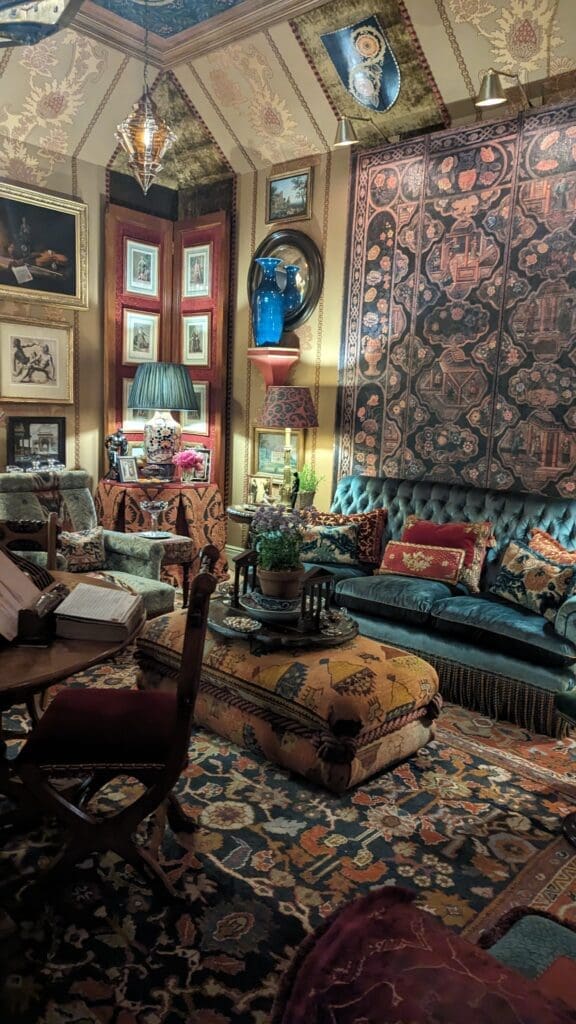 Eclectic room full of antiques and art