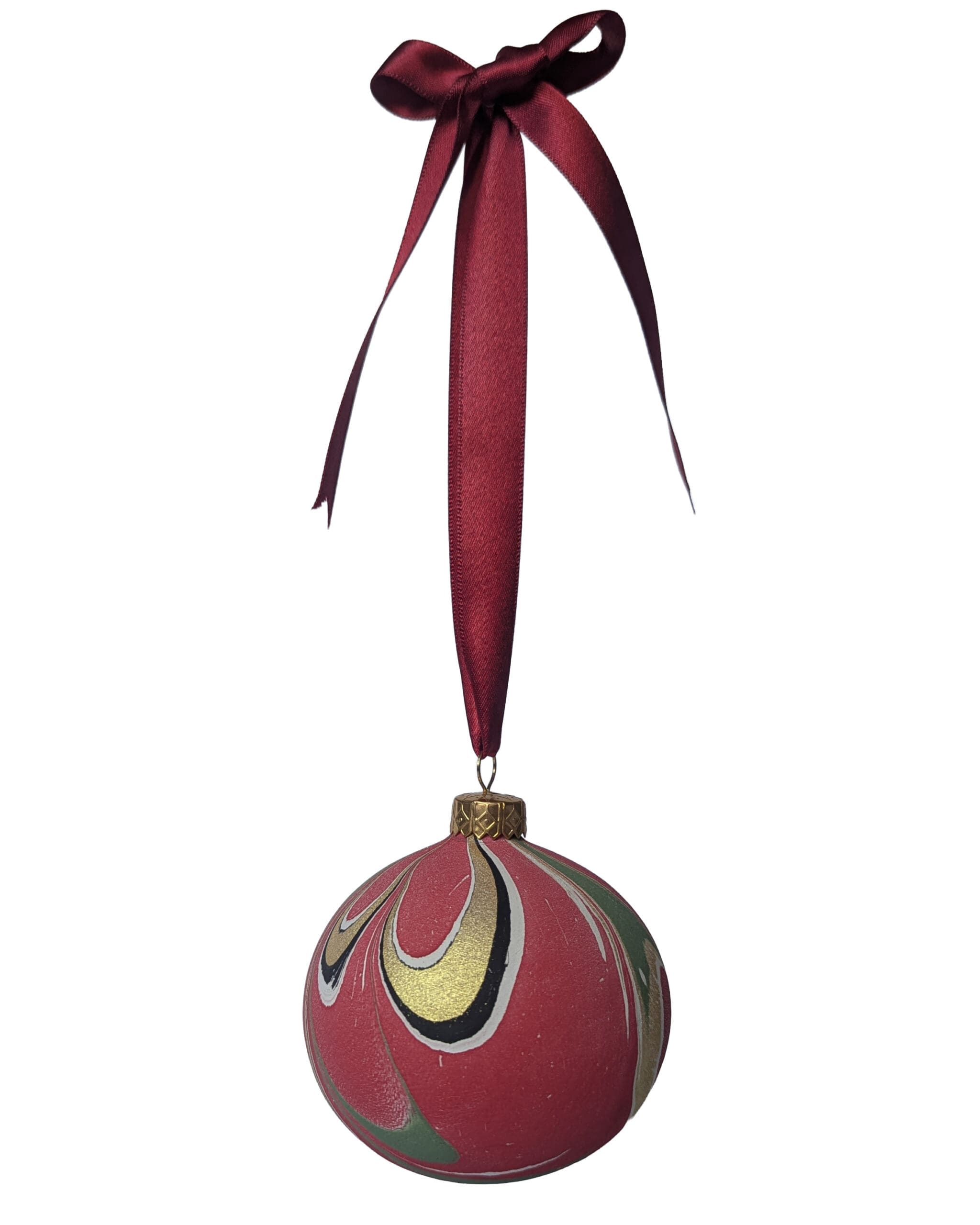 Red, gold and green marbled christmas bauble hanging on red ribbon bow