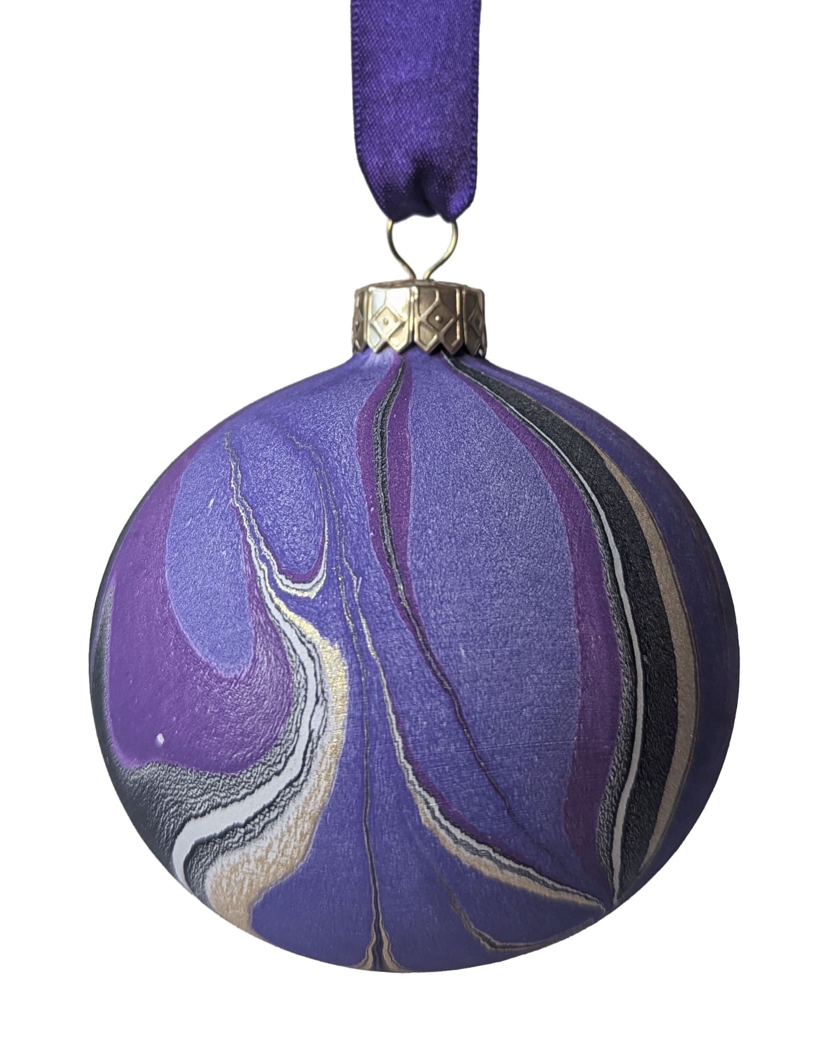 Purple, black and gold marbled Christmas bauble hanging on purple ribbon