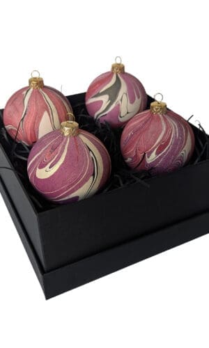 Box of cherry red, plum and gold marbled Christmas baubles in a square black gift box