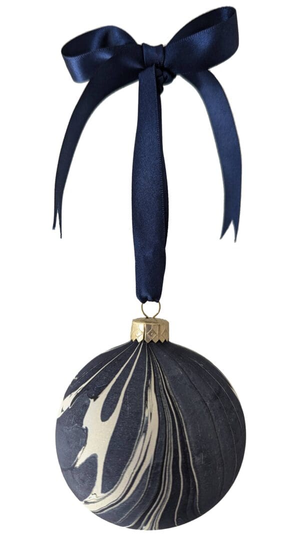 Navy and gold marbled Christmas bauble with navy ribbon