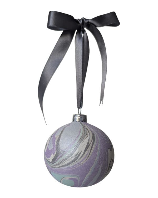 Winter Pearl hand marbled Christmas bauble in pearlescent colours hung with grey satin bow